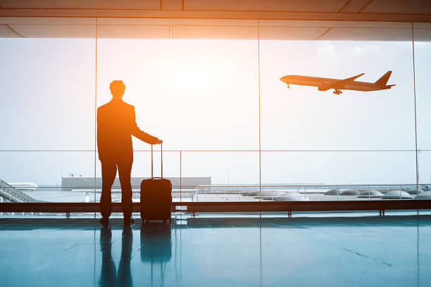 business man with luggage waiting in the airport